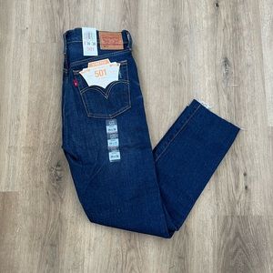 Levi’s 501 skinny leg with button fly, slight distressing